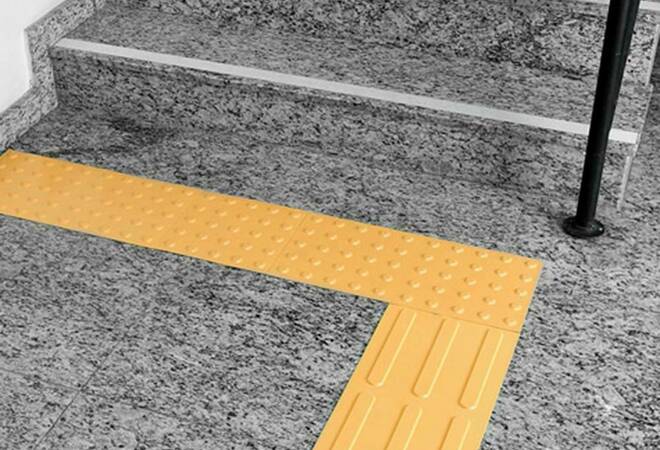Tactile paving and traffic lights with a signal for visually impaired people 