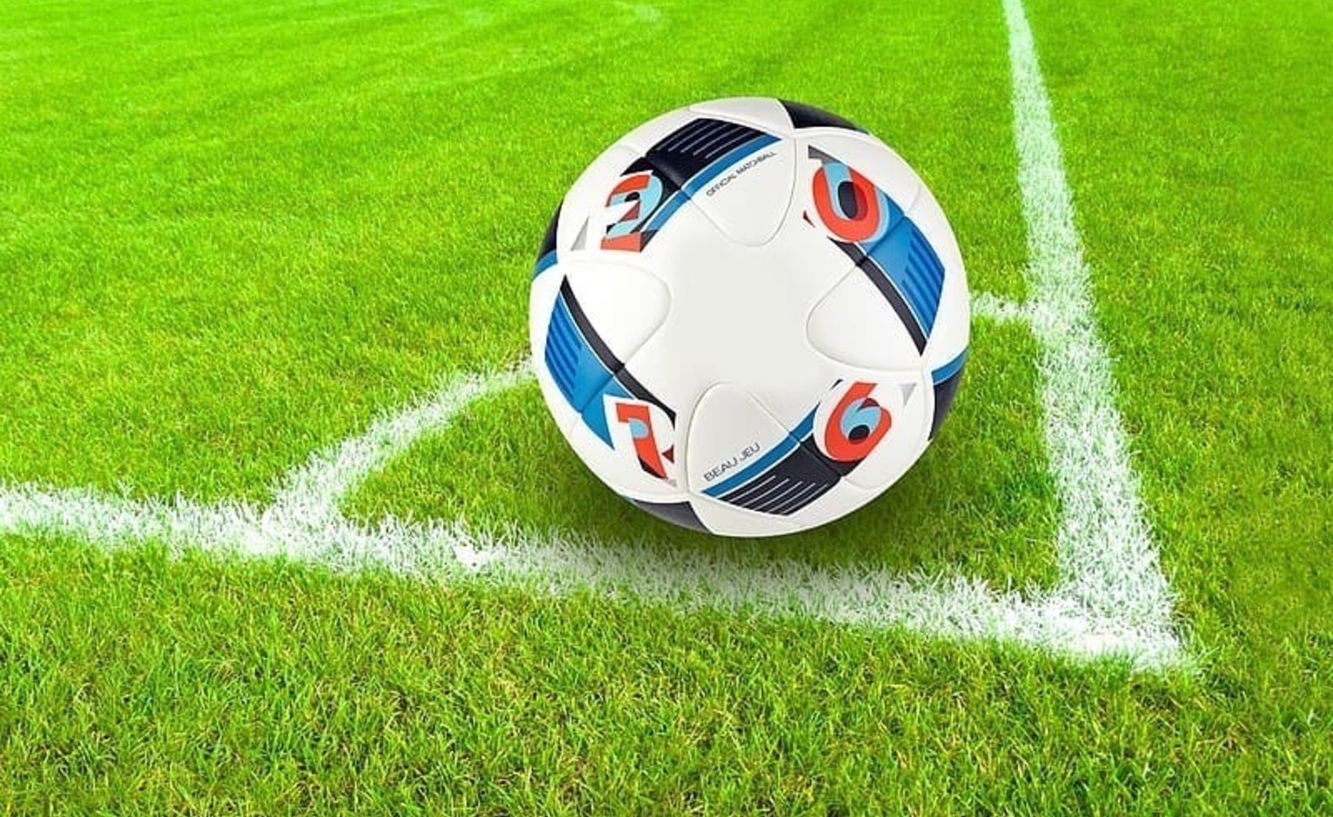 Jalkapallo tekonurmikentällä.